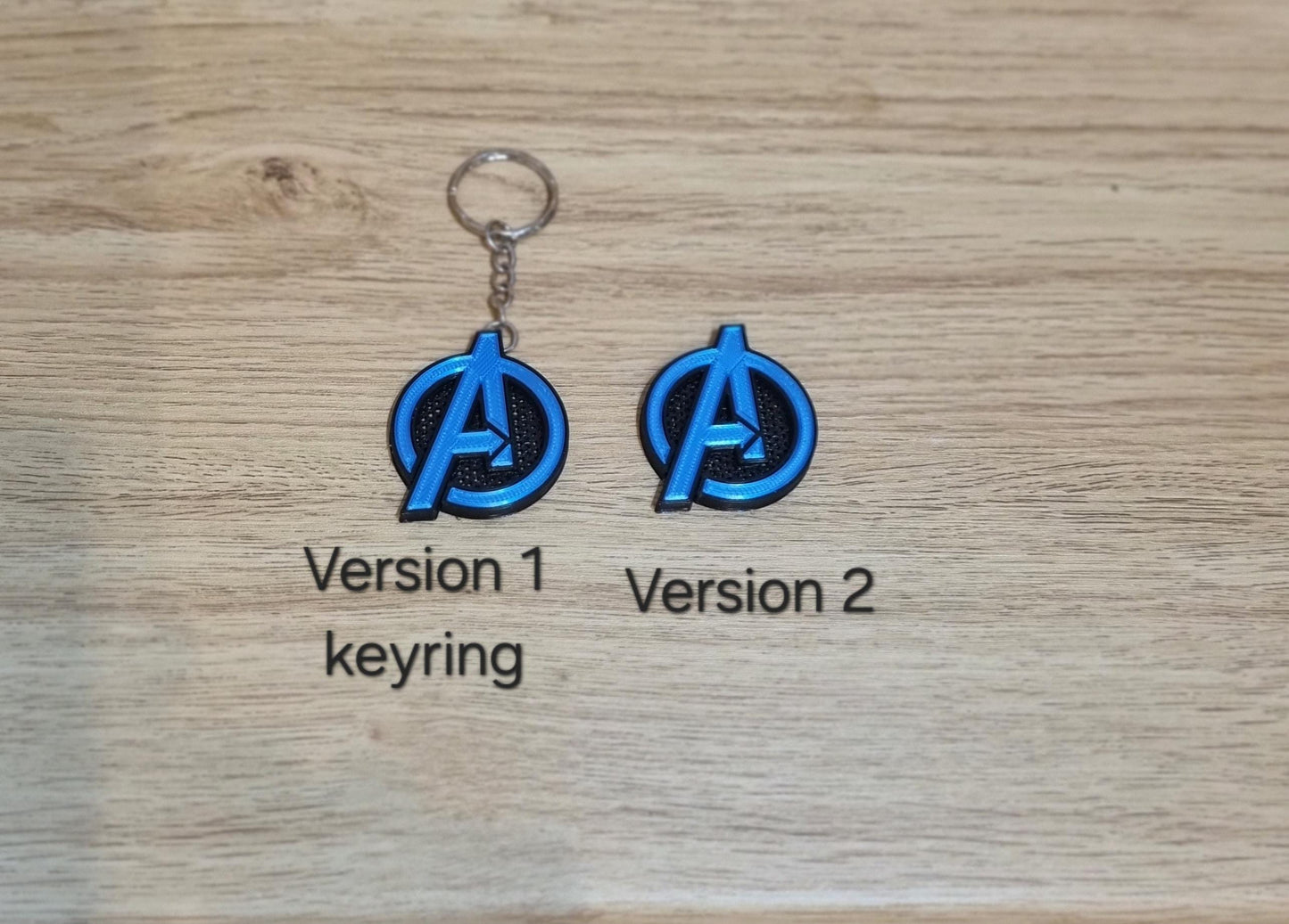 Avengers shiny coin or keychain in blue and black. UK seller