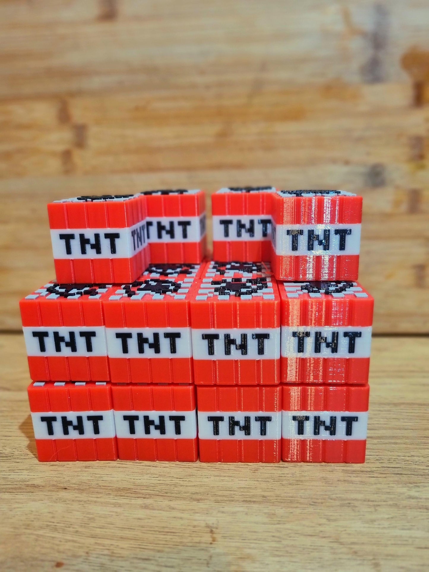 Two Minecraft TNT solid blocks.